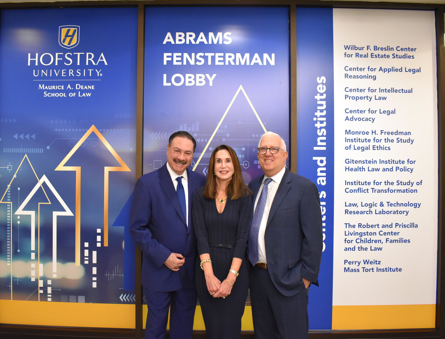 The main entryway into the Maurice A. Deane School of Law at Hofstra University is now known as Abrams Fensterman Lobby after the Lake Success-based firm that has provided money and instruction at the school. Joining in the dedication were, from left, Abrams Fensterman managing partner Howard Fensterman, Hofstra Law dean Gail Prudenti, and Abrams Fensterman executive partner Robert Abrams.